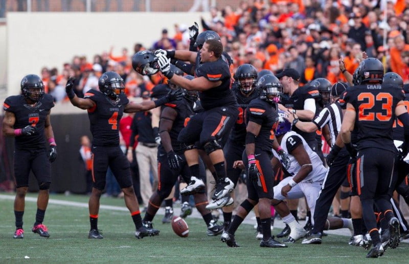 Oct 27 2012 Stillwater OK USA Oklahoma State Cowboys teammates celebrate during the fourth quarter against the TCU Horned Frogs at Boone Pickens Stadium. Mandatory Credit Richard Rowe US PRESSWIRE