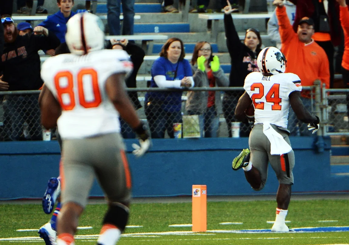 Tyreek Hill scores on a kick return in Lawrence (USATSI)