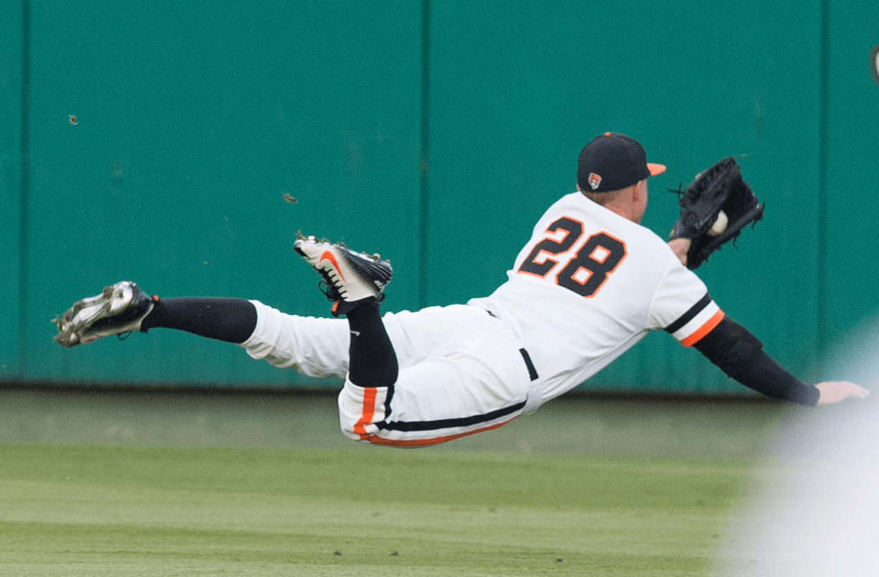 Corey Hassel makes an outstanding diving catch in Friday night’s game against Kansas State. (Via OSU Athletics)